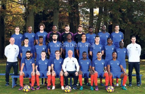 France's national football team (3rd row, from L): France's defender Lucas Digne, defender Djibril Sidibé, midfielder Adrien Rabiot, goalkeeper Steve Mandanda, goalkeeper Hugo Lloris, goalkeeper Benoit Costil, defender Samuel Umtiti, midfielder Moussa Sissoko and defender Adil Rami. (2nd row, from L): France's assistant coach Guy Stephan, defender Sebastien Corchia, forward Kingsley Coman, forward Olivier Giroud, midfielder Paul Pogba, defender Raphael Varane, defender Laurent Koscielny, forward Ousmane Dembele, midfielder N'Golo Kante and goalkeeper coach Franck Raviot. (front row, from L) : France's forward Nabil Fekir, France's forward Kevin Gameiro, France's forward Antoine Griezmann, France's head coach Didier Deschamps, France's midfielder Blaise Matuidi, France's forward Dumitri Payet and defender Patrice Evra, pose on November 8, 2016 in Clairefontaine-en-Yvelines, near Paris. / AFP PHOTO / FRANCK FIFE