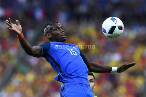 France's midfielder Paul Pogba plays the ball during the Euro 2016 group A football match between France and Romania at Stade de France, in Saint-Denis, north of Paris, on June 10, 2016. / AFP PHOTO / FRANCK FIFE