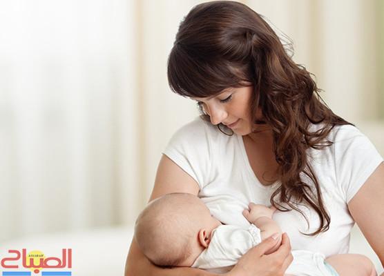 Young mother feeding breast her newborn baby at home in white room | جريدة الصباح